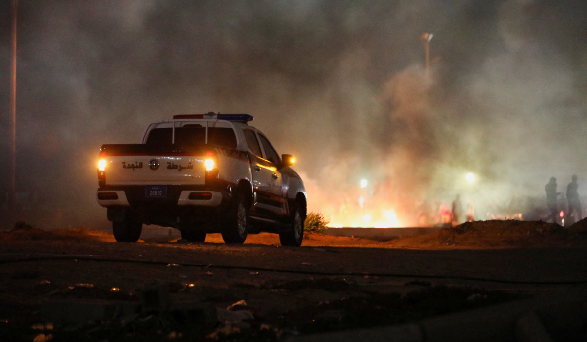 Demonstrators burn tires in Tripoli in protest against the meeting between the foreign affairs ministers of Libya and Israel held last week in Italy. (Reuters)