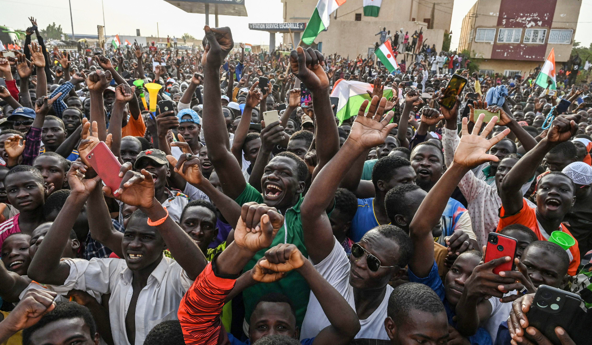 Supporters of Niger's National Council of Safeguard of the Homeland (CNSP) protest outside Niger and French airbase in Niamey on September 1, 2023 to demand the departure of the French army from Niger. (AFP)