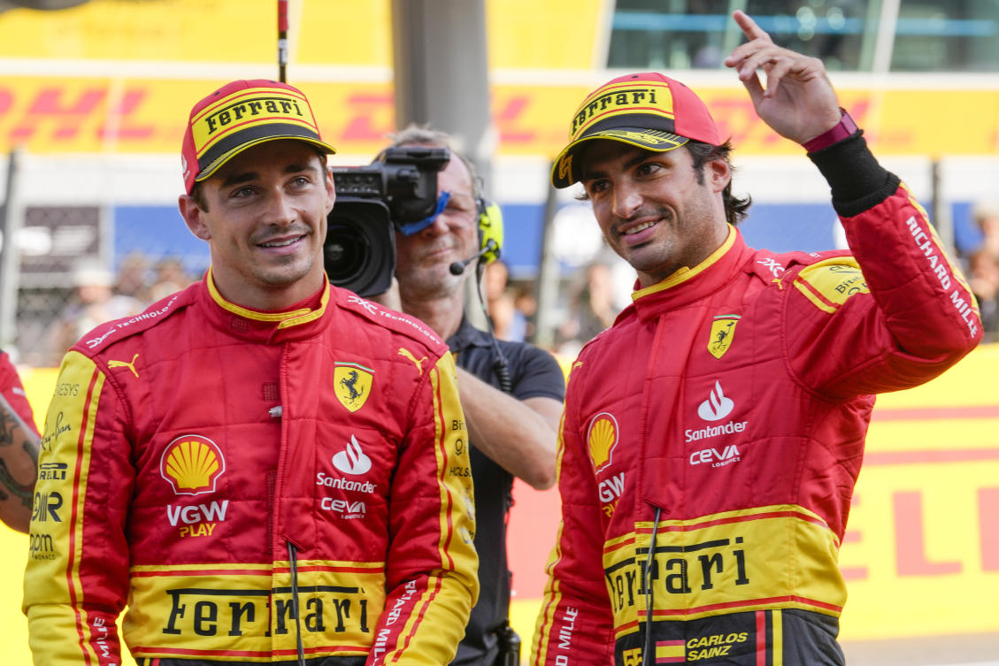Ferrari driver Carlos Sainz of Spain, right, celebrates his pole position with third placed Ferrari driver Charles Leclerc of Monaco after the qualifying session ahead of Sunday's F1 Italian Grand Prix auto race, at the Monza racetrack, in Monza, Italy, on Sept. 2, 2023. (AP)