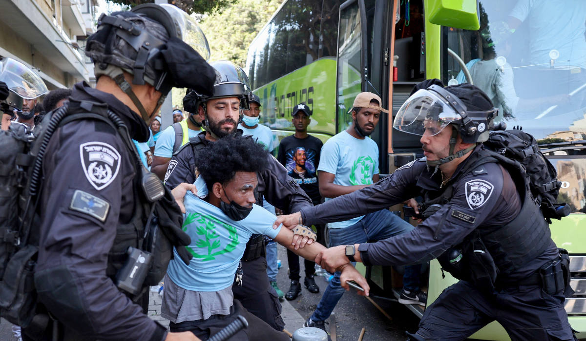 Members of Israel's security forces clash with Eritrean asylum-seekers protesting an event organised by Eritrea's government in the coastal city of Tel Aviv on September 2, 2023. (AFP)