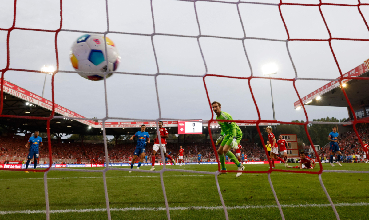 Leipzig's Slovenian forward #30 Benjamin Sesko (R) scores the 2-0 goal past Union Berlin's Danish goalkeeper #01 Frederik Ronnow (5R) during the Bundesliga football match between 1 FC Union Berlin and RB Leipzig in Berlin on Sunday. (AFP)