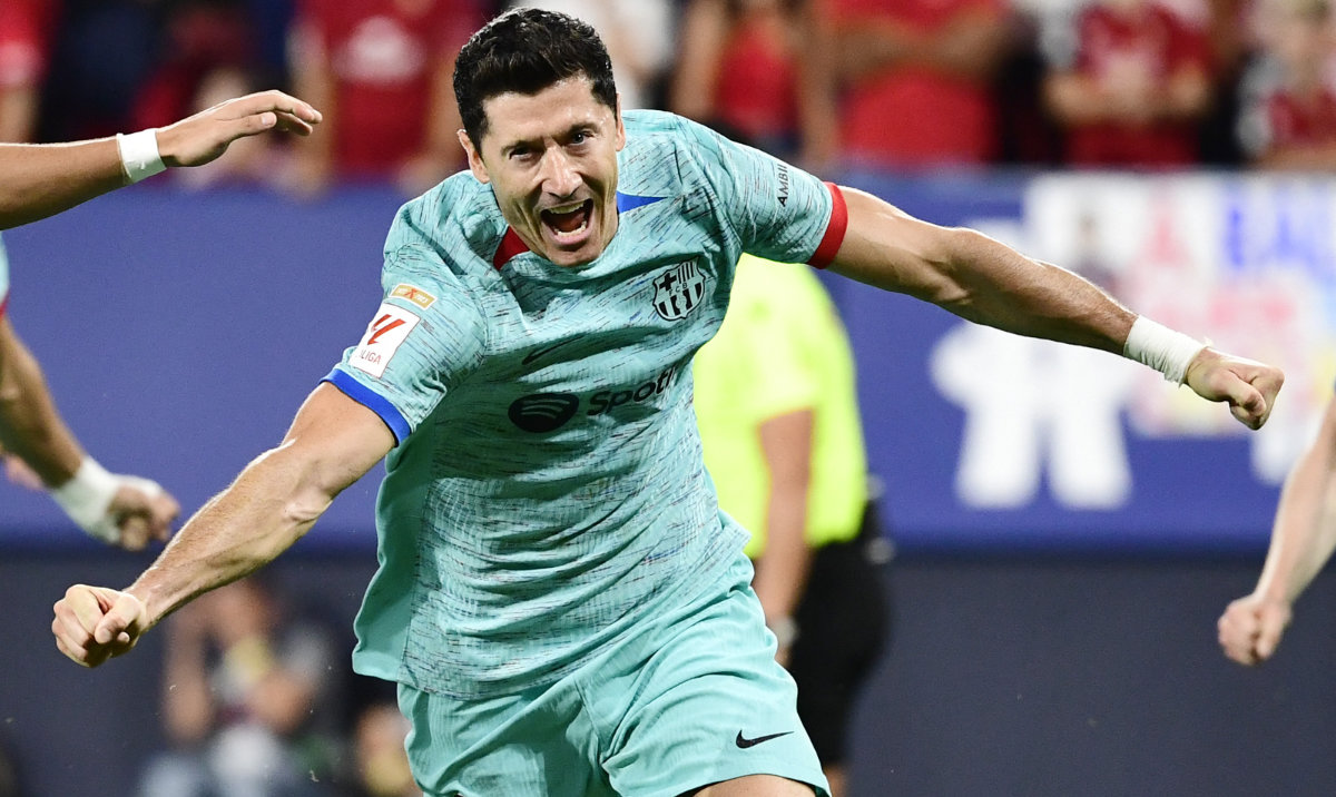 Barcelona's Polish forward Robert Lewandowski celebrates scoring his team's second goal scored from the penalty spot during the Spanish Liga football match between CA Osasuna and FC Barcelona at El Sadar stadium in Pamplona on Sunday. (AFP)