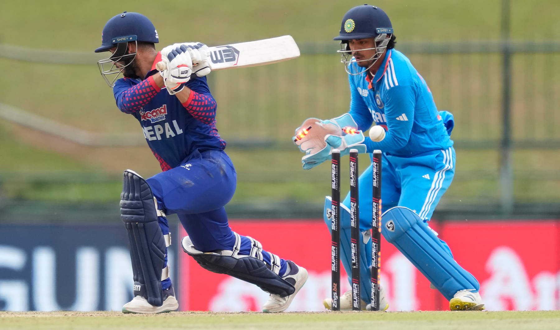 Nepal's Bhim Sharki is bowled out as Indian wicketkeeper Asian Kishan watches during the Asia Cup cricket match between India and Nepal in Pallekele, Sri Lanka on September 4, 2023. (Photo courtesy: AP)