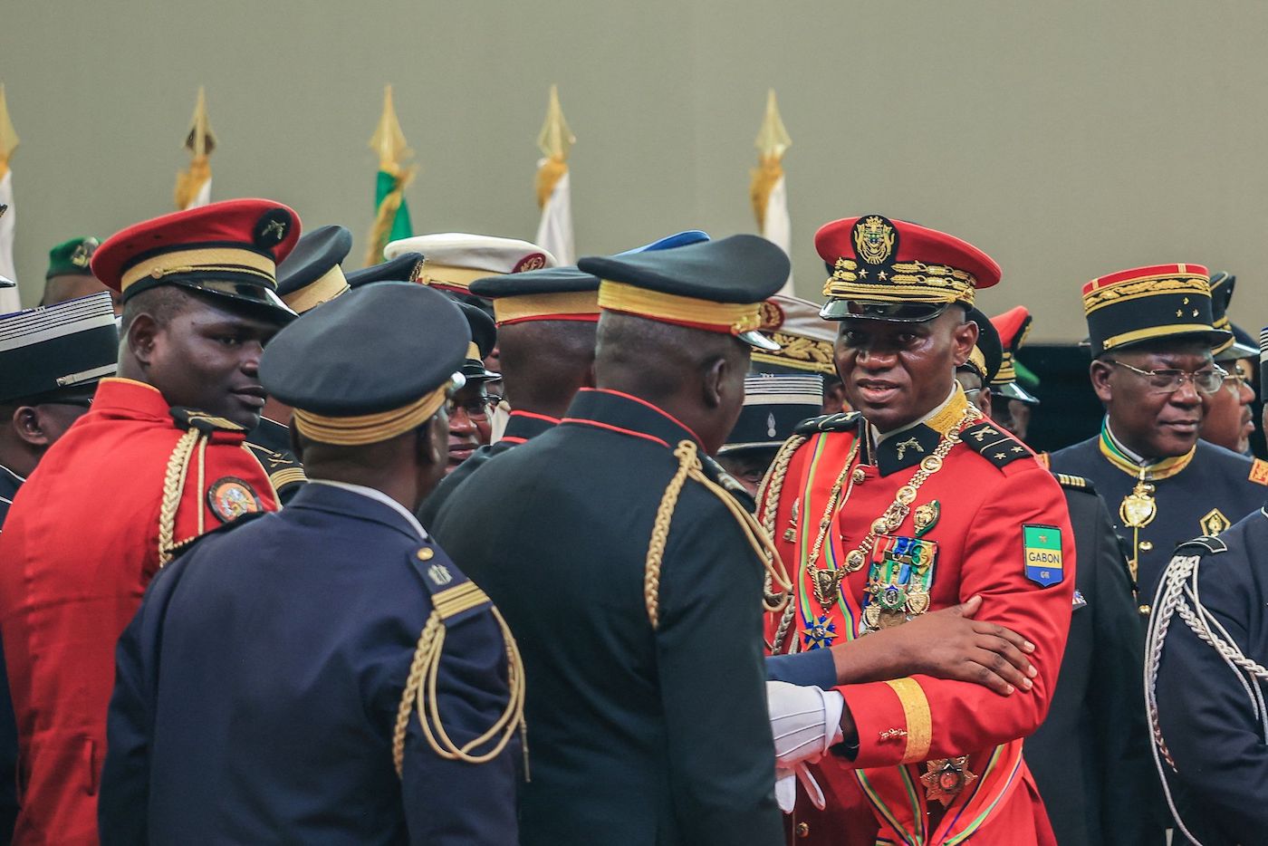 Gabon’s new strongman General Brice Oligui Nguema (2nd R) greets members of staff after he was inaugurated as Gabon’s interim President. (AFP)