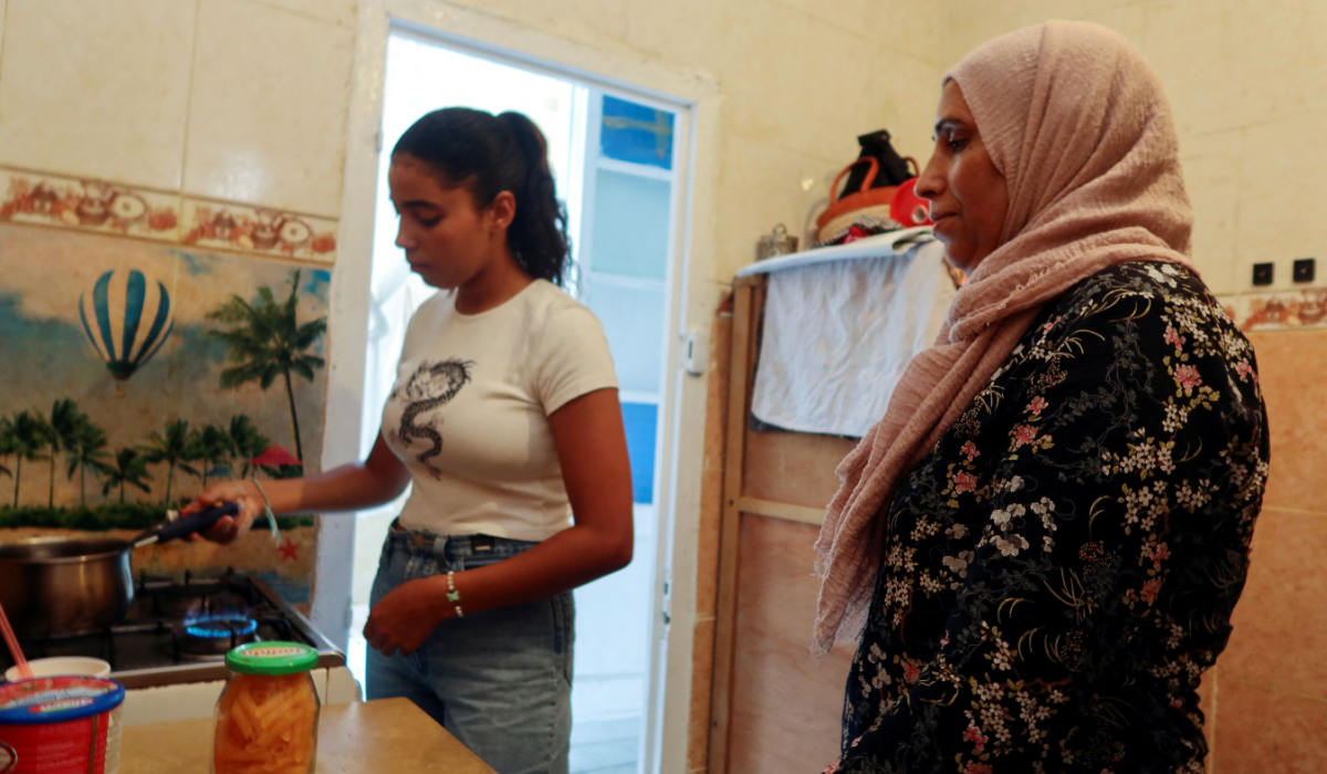 Siwar Derbeli, an 18-year-old Tunisian with coeliac disease, stands with her mother, Hasna Arfaoui, as they prepare a gluten-free pasta meal in their kitchen, in Tunis, Tunisia August 30, 2023. (REUTERS)