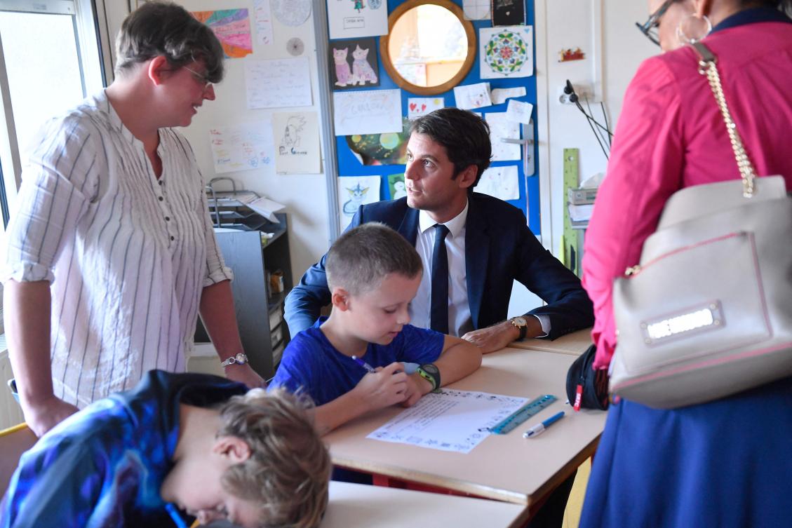 French Education and Youth Minister Gabriel Attal visited Amandine Mallet school, on the first day of the academic year, as 12 million students go back to school in France. (File/AFP)