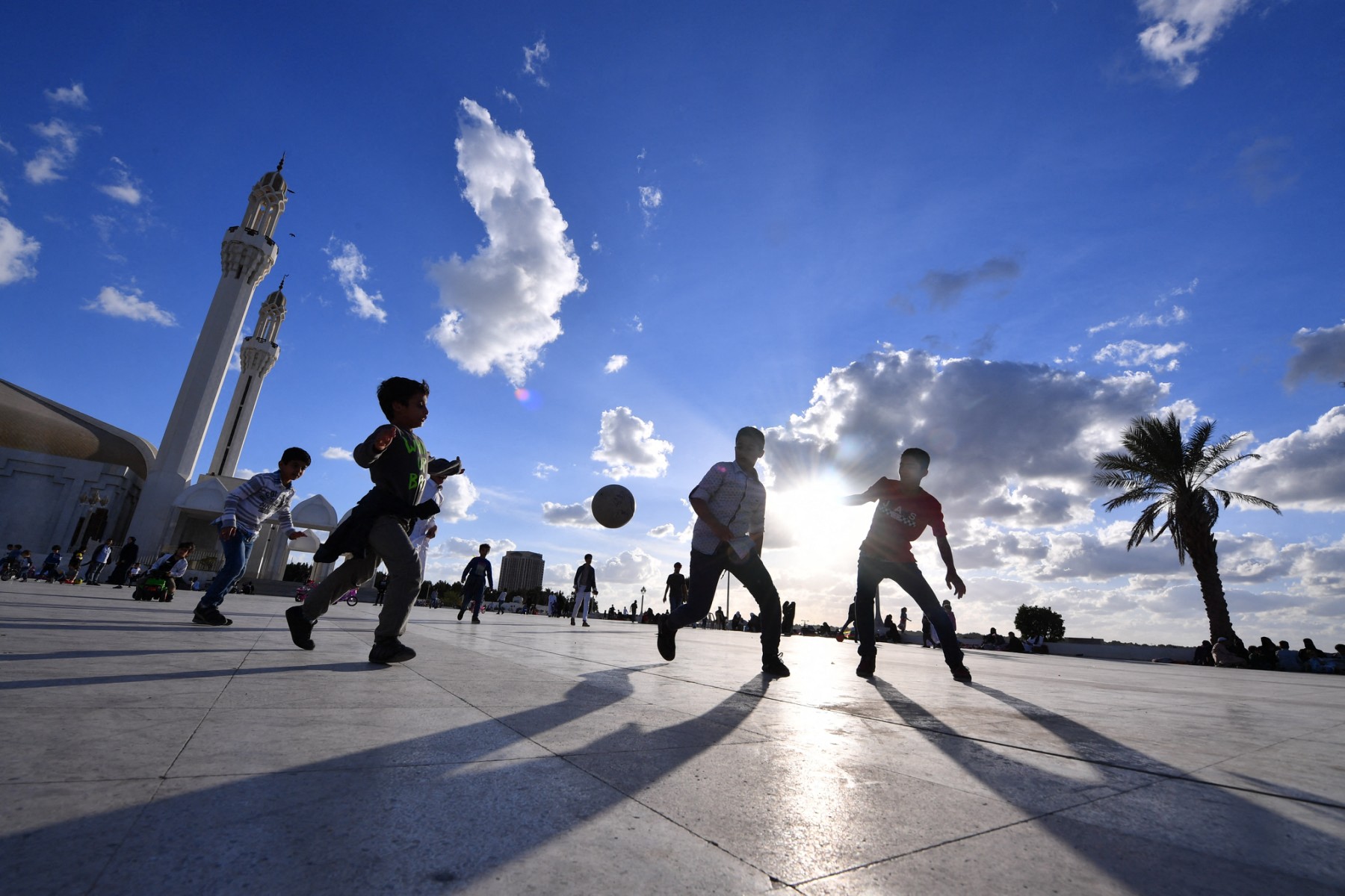 Children play on the esplanade in front of the Hasan Anani mosque in the Saudi Arabian port city of Jeddah on January 10, 2020. (AFP)