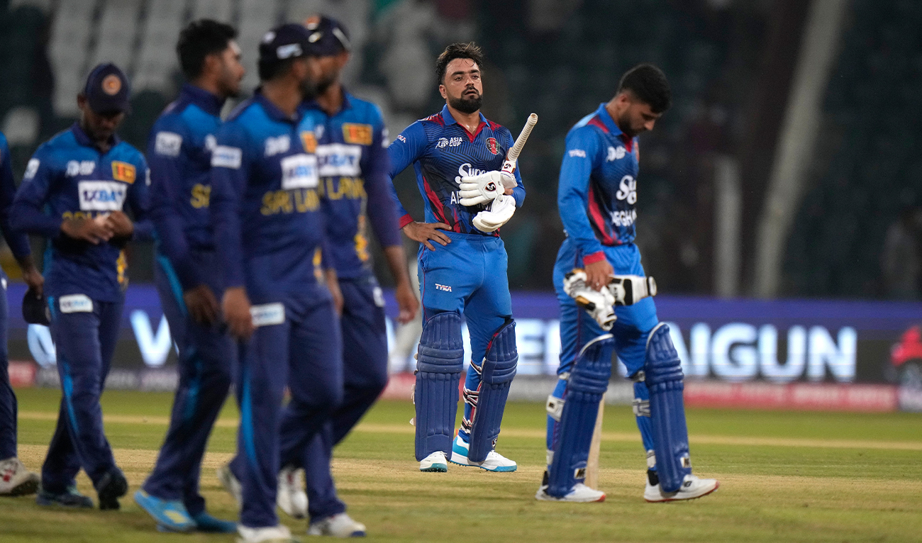 Afghanistan's Rashid Khan, second right, reacts after losing match on the end of the Asia Cup cricket match between Afghanistan and Sri Lanka in Lahore, Pakistan, on September 5, 2023. (Photo courtesy: AP)