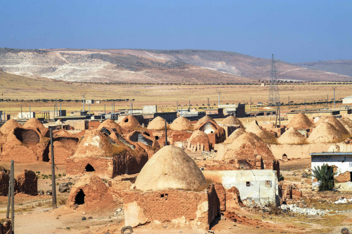 Umm Amuda al-Kabira in Aleppo province is among a handful of villages where residents long used to live in small domed houses made of mud bricks and brittle hay. (AFP)