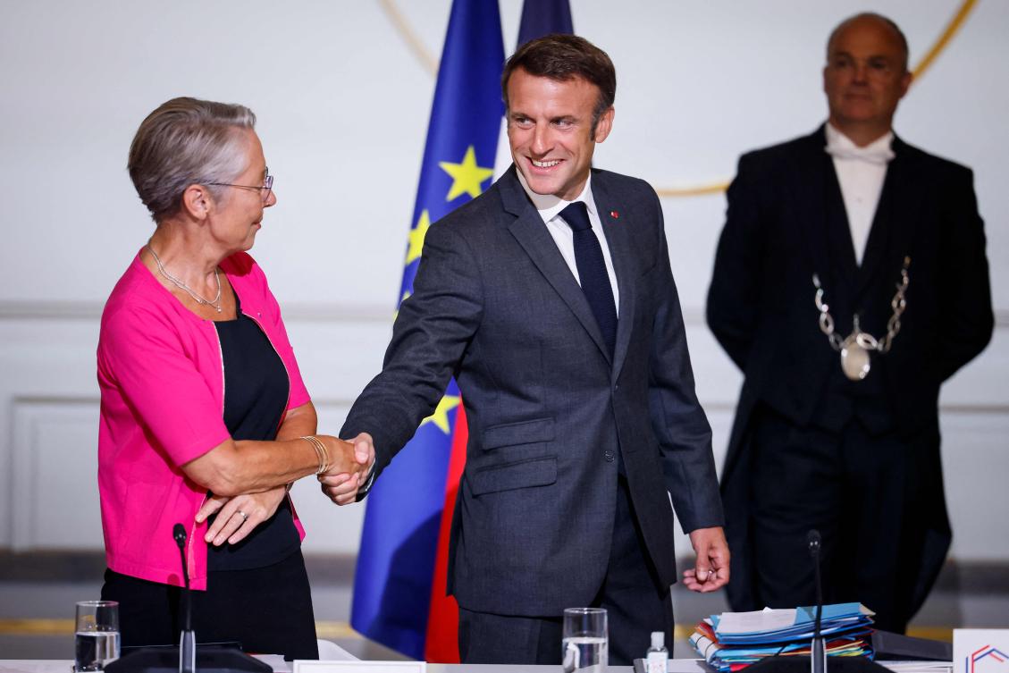 French President Emmanuel Macron shakes hands with French PM Elisabeth Borne at the start of the third plenary session of the CNR (National Council for the Refoundation) on Sept. 7, 2023 at the Elysee palace in Paris. (AFP)