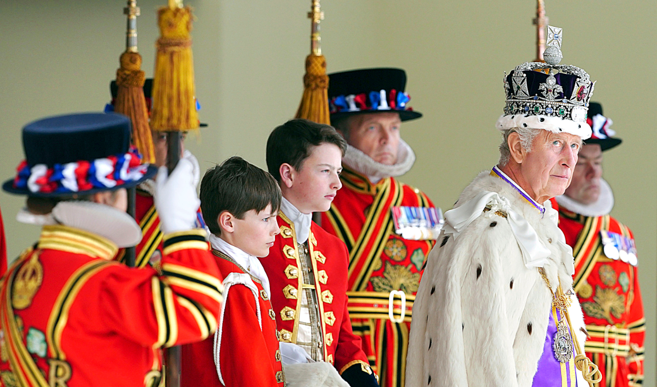 Britain’s King Charles III arrives to receive a royal salute from members of the military in the gardens of Buckingham Palace in London on May 6. (AP)