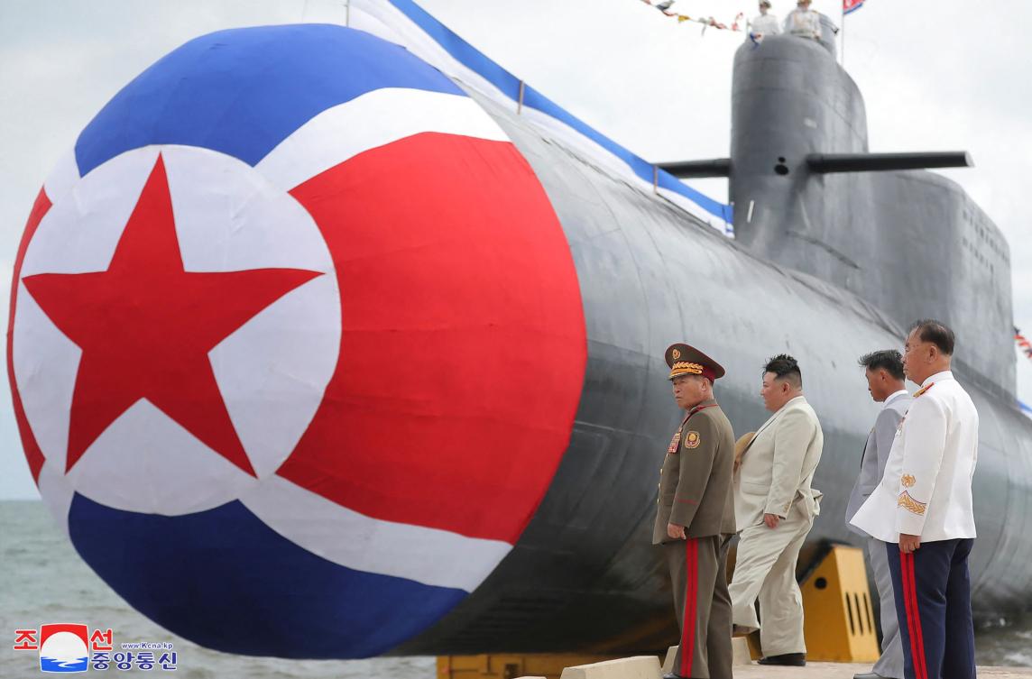 North Korean leader Kim Jong Un attended the unveiling ceremony of the new submarine No. 841, named the Hero Kim Kun Ok, at an undisclosed location in North Korea. (AFP)