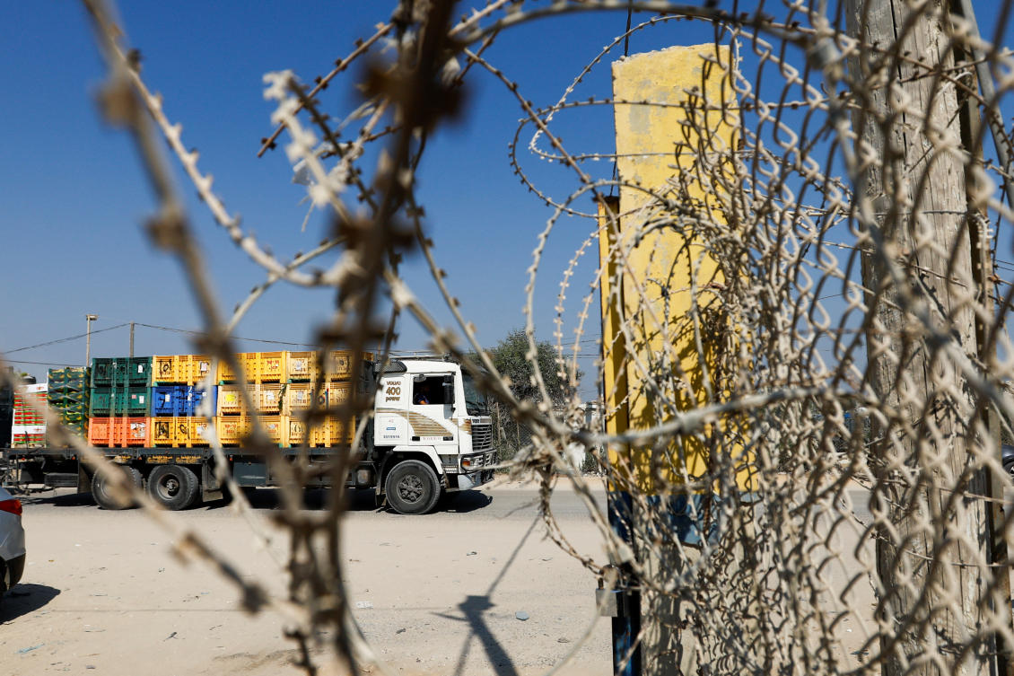 A view of Palestinian goods trucks in front of the commercial crossing of Kerem Shalom after the Israeli ban on Gaza exports deals a blow to the long-suffering economy, in Gaza Strip, Sept. 5, 2023. (Reuters)