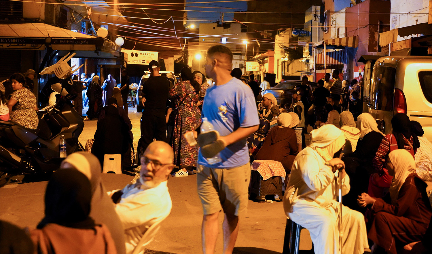 People gather on a street in Casablanca, following a powerful earthquake in Morocco, on September 9, 2023. (REUTERS)