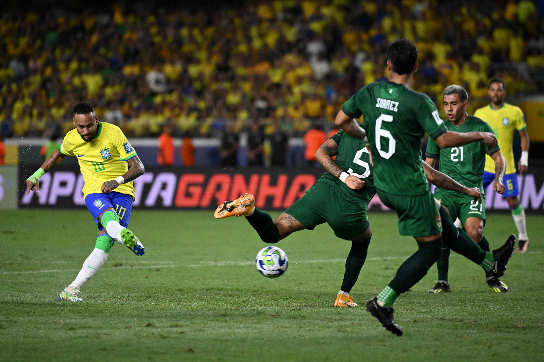 Brazil's forward Neymar (L) strikes and scores a goal during the 2026 FIFA World Cup South American qualifiers football match between Brazil and Bolivia at the Jornalista Edgar Proença 'Mangueirao' stadium, in Belem, state of Para, Brazil. (AFP)