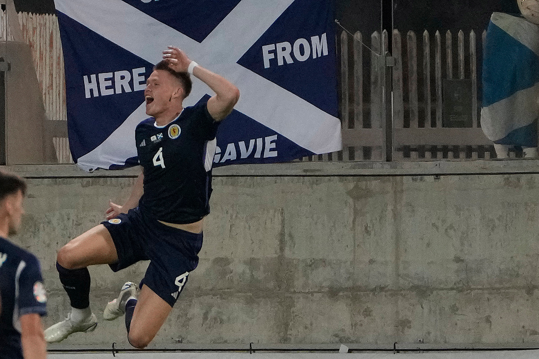Scotland's Scott McTominay celebrates after scoring against Cyprus during the Euro 2024 Group A qualifying soccer match between Cyprus and Scotland at AEK arena stadium in Larnaca, Cyprus. (AP)