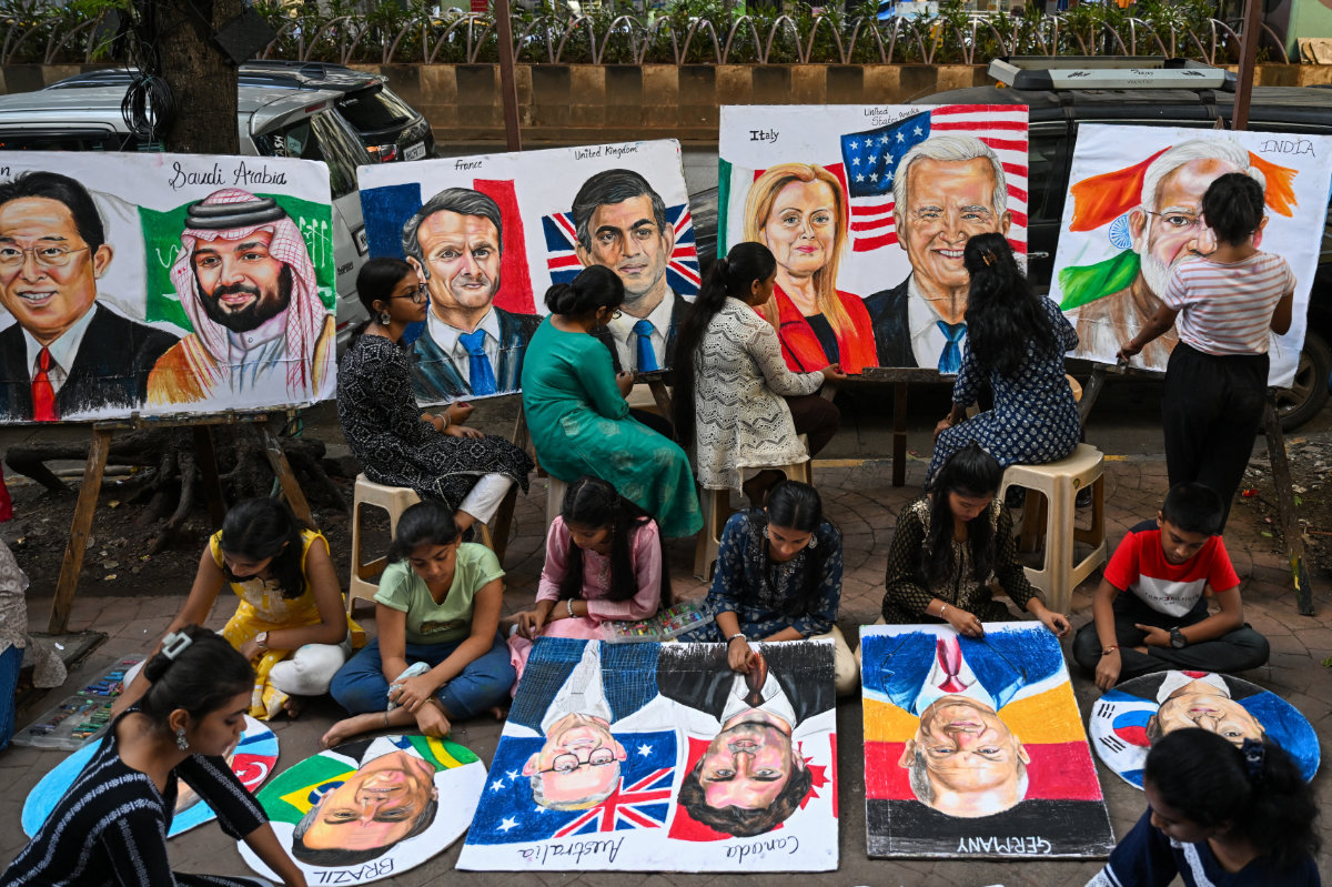 Students work on paintings of world leaders at an art school in Mumbai, main, ahead of the G20 Summit in New Delhi. (AFP)