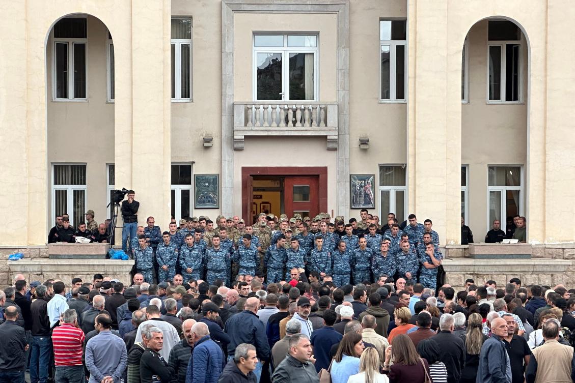 Law enforcement officers stand guard outside Nagorno-Karabakh’s Parliament building during the election of a new president in Stepanakert, on Sept. 9, 2023. (AFP)