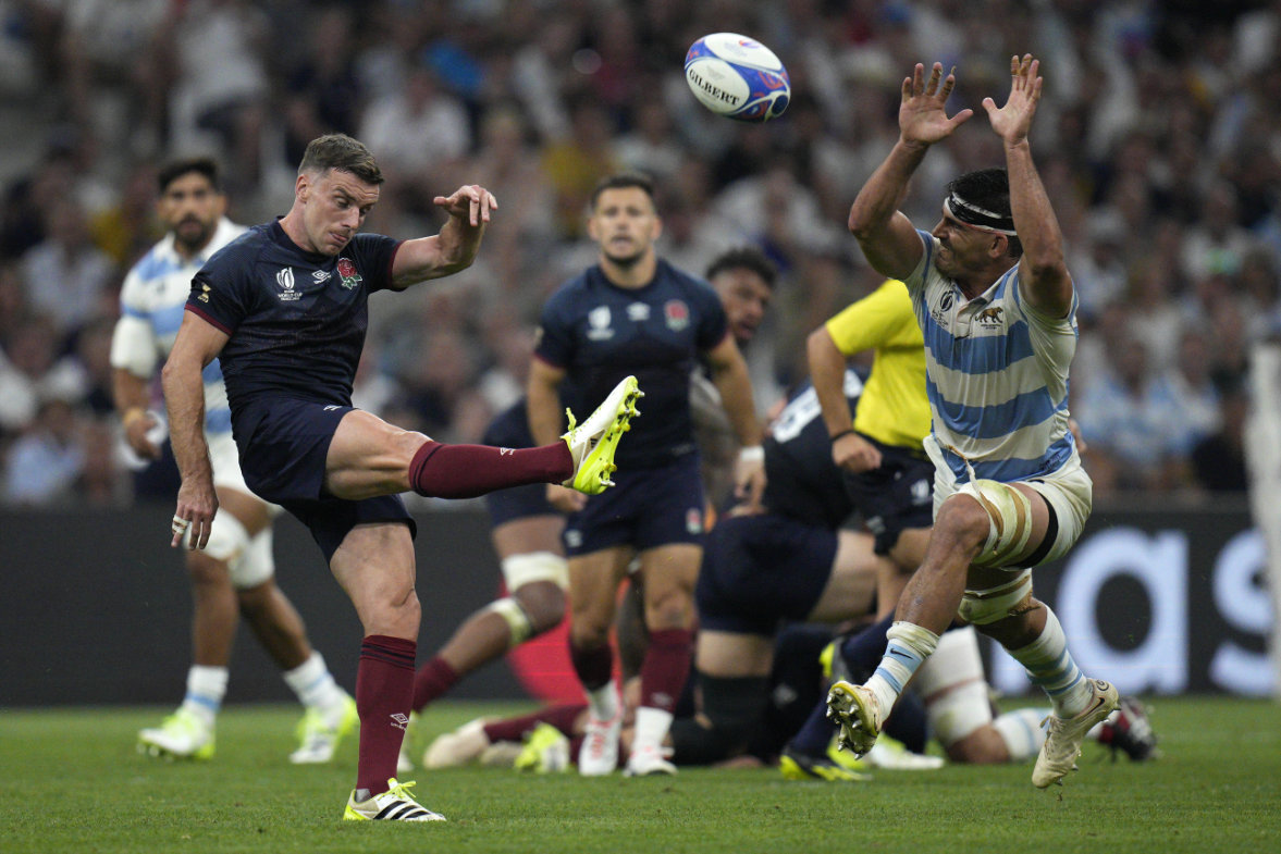 England's George Ford, left, clears the ball during the Rugby World Cup Pool D match between England and Argentina in the Stade de Marseille Saturday. (AP)