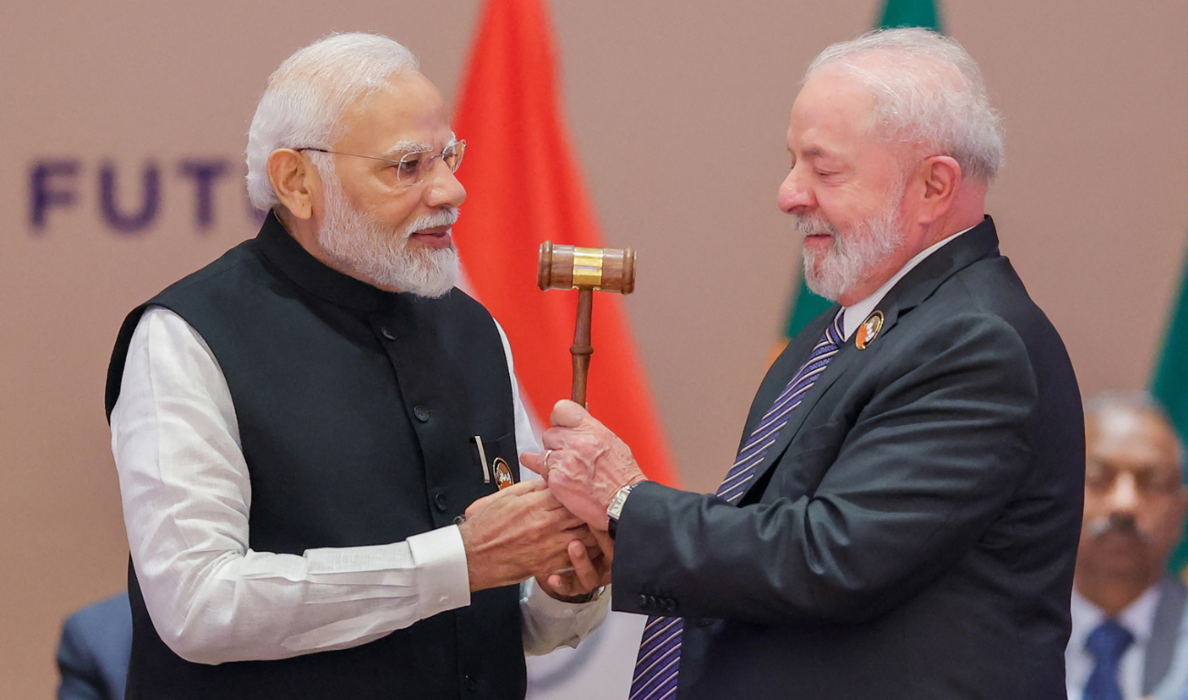 India’s Prime Minister Narendra Modi (L) hands over the gavel to Brazil’s President Luiz Inacio Lula da Silva (R) during the third working session of the G20 Leaders’ Summit in New Delhi on September 10, 2023. (AFP)