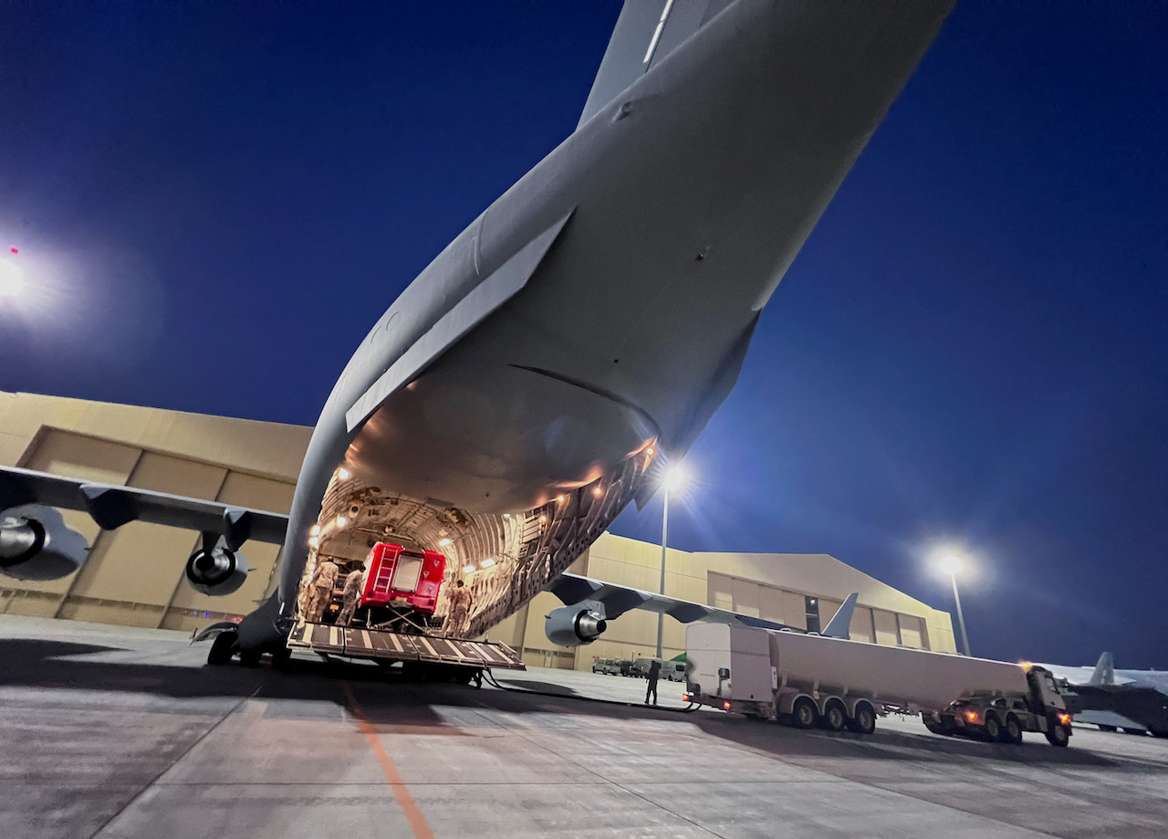 Members of the Qatar Emiri Air Force load up Lekhwiya's International Search and Rescue Group equipments onto a military cargo aircraft headed to Morocco to provide support on the ground, following an earthquake that struck the country, at Al Udeid Air Base, in Doha, Qatar, Sept. 10, 2023. (Reuters)