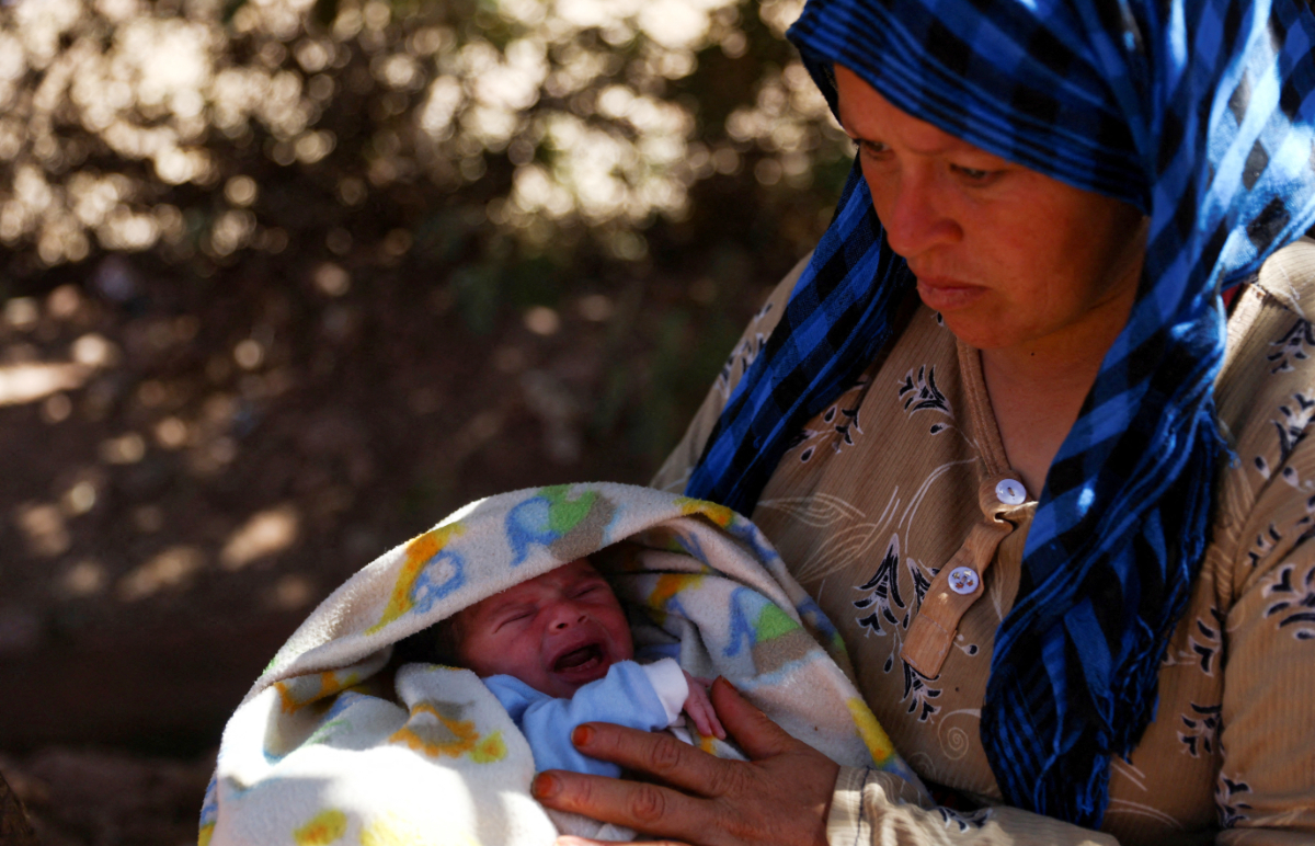 Kiltom Aitbrahimoblla holds her 15-day-old child Salah Achariy, who survived the deadly earthquake, in Tinmel, Morocco, September 11, 2023. (REUTERS)