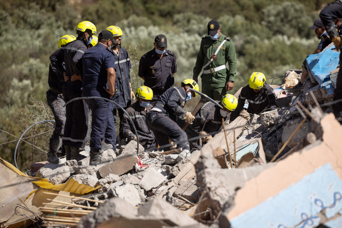 Moroccan rescuers search the rubble for survivors in Talat N'Yacoub village of al-Haouz province in earthquake-hit Morocco on September 11, 2023. (AFP)