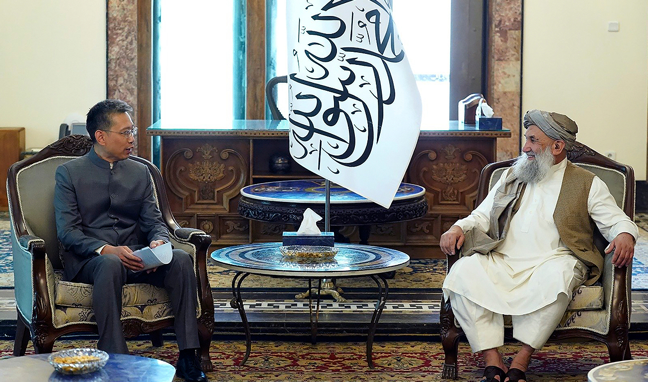 In this handout photo released by the Taliban Prime Minister Media Office, China's new ambassador to Afghanistan Zhao Sheng meets with Taliban Prime Minister Mohammad Hasan Akhund during the recognition ceremony at the Presidential Palace in Kabul, Afghanistan, Wednesday, Sept. 13, 2023. (Taliban Prime Minister Media Office via AP)