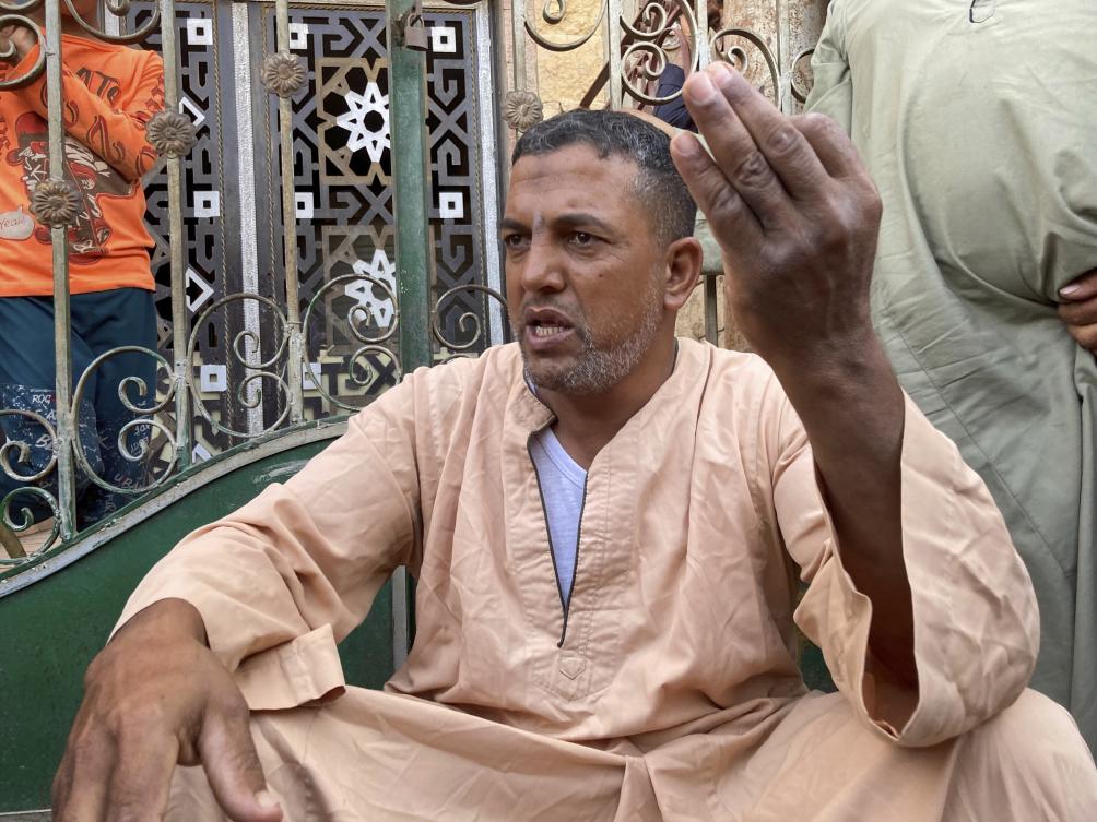 Rashad Ezzat Abdel-Hamid, a 45-year-old Egyptian survivor of the flooding in the Libyan city of Derna, recounts the disaster while sitting near his home in the farming village of Nazlet el-Sharif, Egypt, on Sept. 14, 2023. (AP)