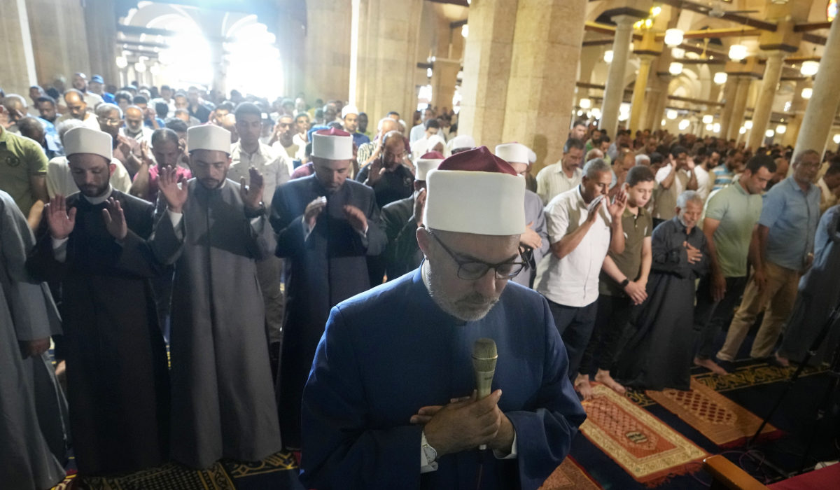 Sheikh Nazir Ayyad leads the absent prayers for the victims of flooding in Libya and earthquake in Morocco at the Al-Azhar mosque, the Sunni Muslim world's premier Islamic institution, in Cairo, Friday, Sept. 15, 2023. (AP)