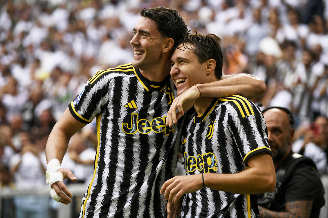 Juventus’ Federico Chiesa celebrates with teammate Dusan Vlahovic after scoring their side’s second goal during their Serie A match against Lazio, at Turin’s Juventus Stadium on Sept. 16, 2023. (AP)