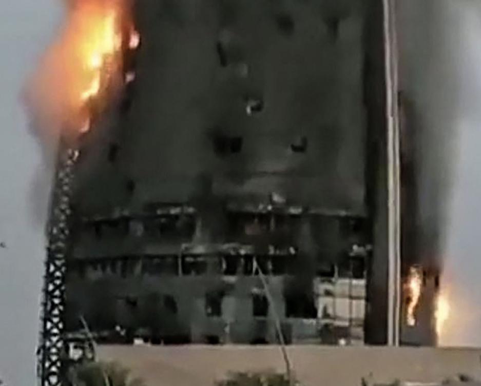 Fire engulfs an 18-story tower block in Sudan’s capital as rival forces battle for the 6th month