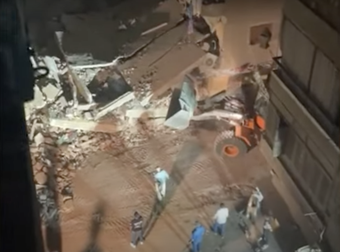 Rescue forces and ambulances quickly arrived and the woman’s body was recovered from the rubble. (Screenshot)