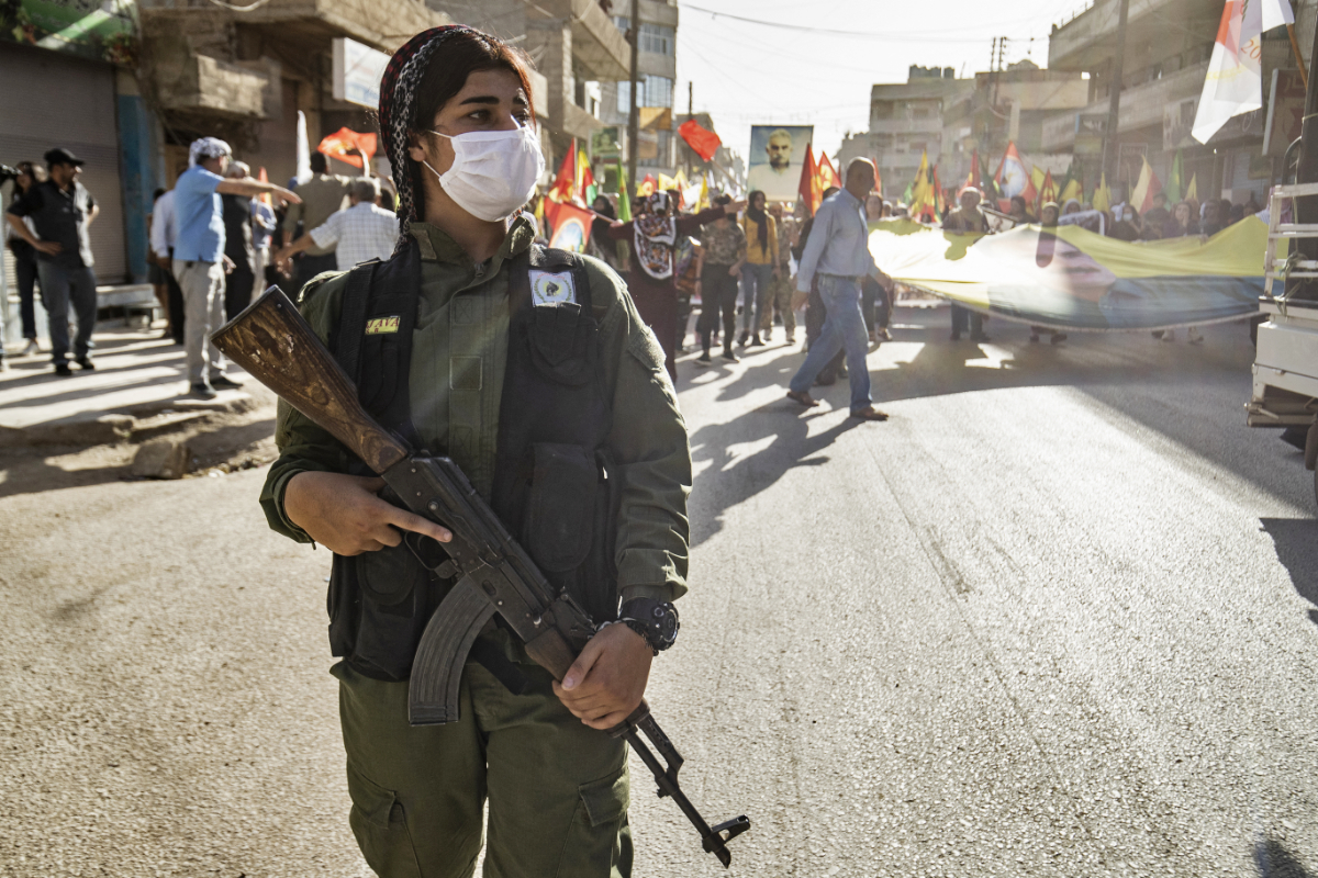 Syrian Kurds demonstrate on June 10, 2021, in the northeastern Syrian city of Qamishli against the Turkish offensive on Kurdistan Workers' Party (PKK) areas in northern Iraq. (AFP)