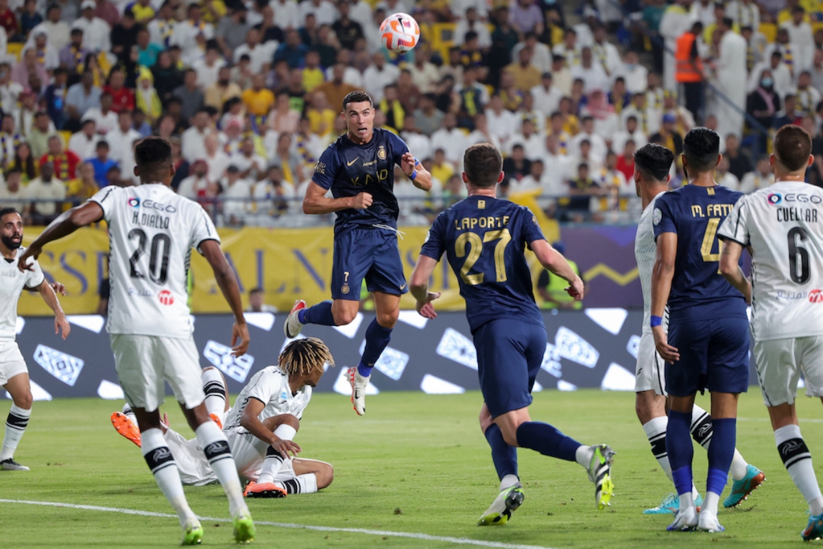 Nassr's Portuguese forward #07 Cristiano Ronaldo (C) heads the ball during the Saudi Pro League football match between Al-Nassr and Al-Shabab in Riyadh's Al-Awal Park Stadium on August 29, 2023. (Photo by Fayez Nureldine / AFP)