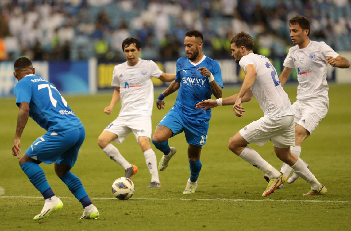 Al-Hilal’s Neymar in action with Navbahor Namangan’s Igor Golban at the King Fahd International Stadium in Riyadh. (Reuters)