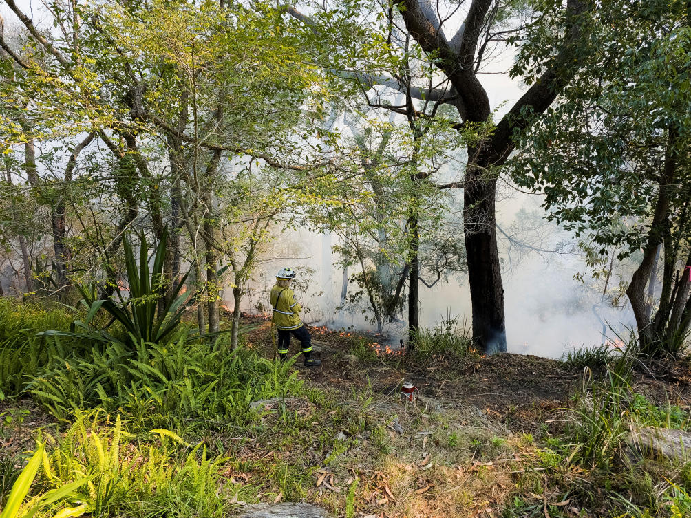 New South Wales Rural Fire Service firefighter Elisabeth Goh monitors a hazard reduction burn in Sydney, Australia on Sept. 10, 2023. (Reuters)