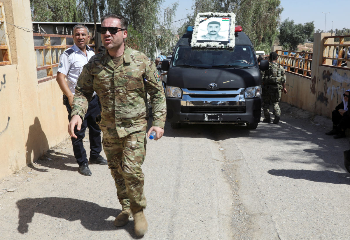 A member of Kurdish forces attends the funeral of a member of the Iraqi counter-terrorism service who was killed in a drone strike on the small military airport of Arbid in Sulaimaniya in Kurdistan region, in Kirkuk, Iraq September 19, 2023. (REUTERS)