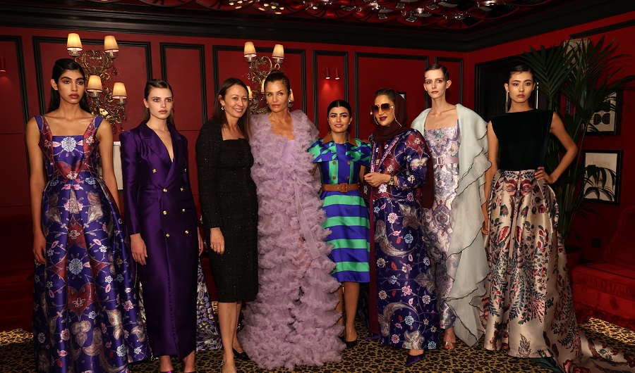 Arwa Al-Ammari (third from right) poses at the London showcase of her latest collection. (Getty Images)