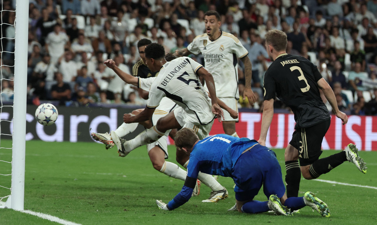 Real Madrid's English midfielder Jude Bellingham scores his team's first goal during the UEFA Champions League 1st round Group C match between Real Madrid and Union Berlin at the Santiago Bernabeu stadium in Madrid on Wednesday. (AFP)