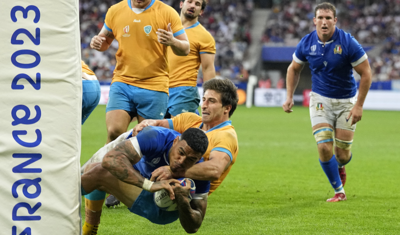 Italy's Monty Ioane scores a try during the Rugby World Cup Pool A match between Italy and Uruguay at the Stade de Nice, in Nice, Wednesday. (AP)