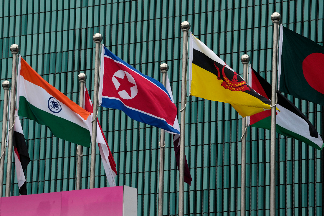 Flags of participating countries, among them North Korea, India, and Brunei, are hoisted at the Athletes Village at the 19th Asian Games in Hangzhou, China. (AP)