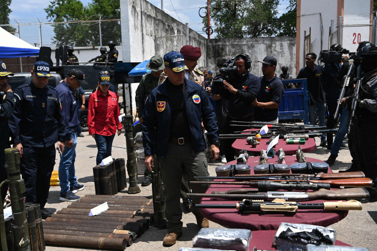Venezuelan authorities display weapons and ammunition seized from a powerful gang of inmates who controlled a prison in Tocoron, Aragua State, Venezuela, on September 21, 2023. (AFP)