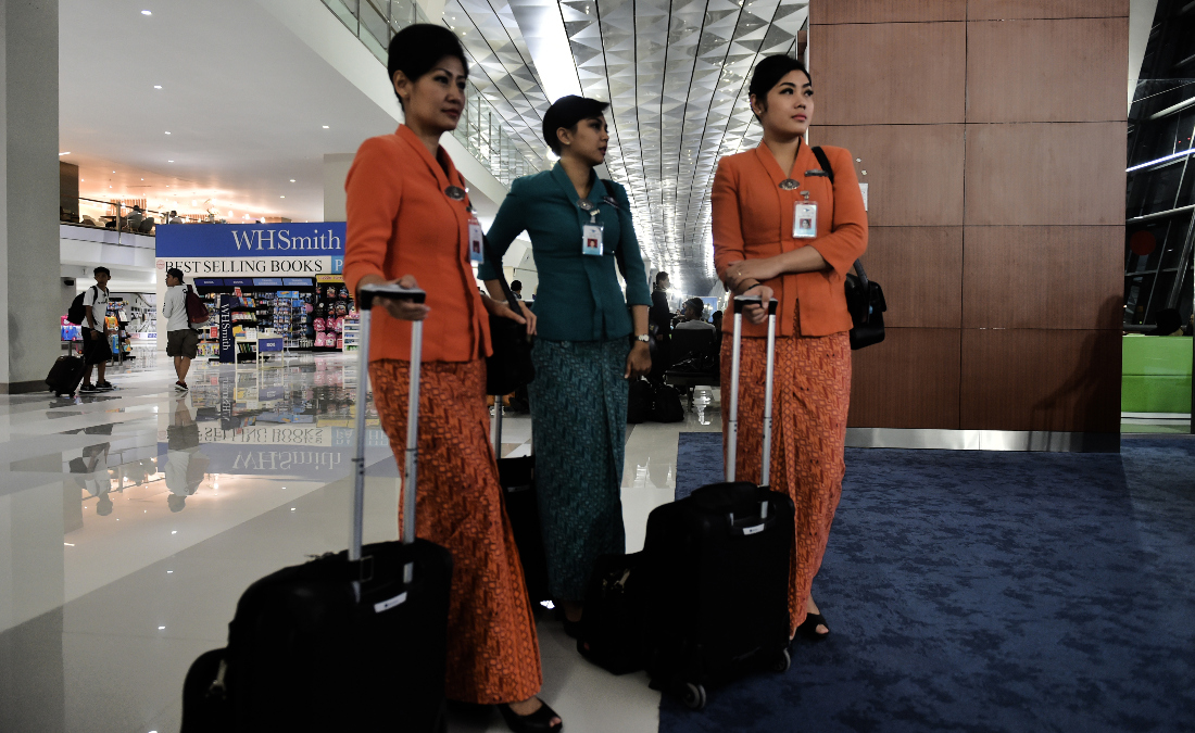 Cabin crew wait to board a flight at Soekarno-Hatta International Airport in Tangerang, on the outskirts of Jakarta, Indonesia. (File/AFP)