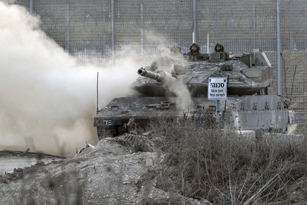 An Israeli tank works along the Israel-Gaza border, where the military says it carried out a series of airstrikes after Palestinians launched incendiary balloons into Israel, on Sept. 22, 2023. (AP)