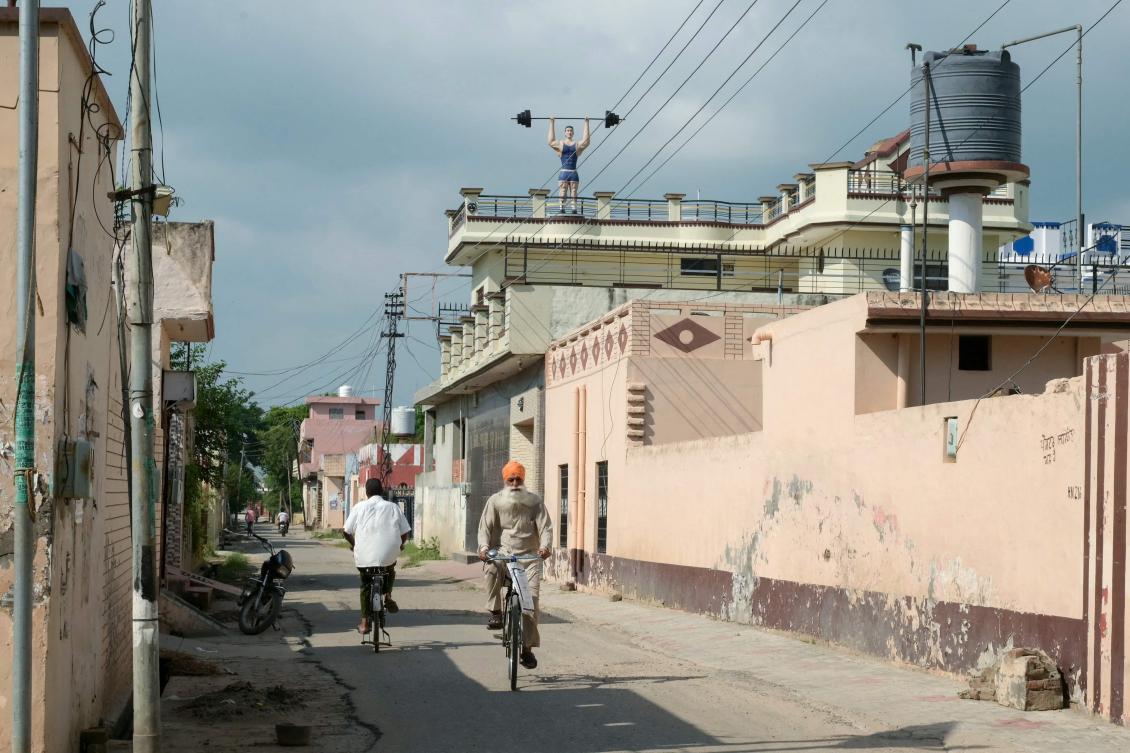 Above, residents ride a bicycle at Bharsingpura, a village of Sikh separatist Hardeep Singh Nijjar. (AFP)