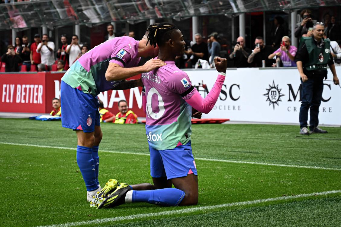 AC Milan’s Portuguese forward Rafael Leao celebrates after scoring a goal with his coach Stefano Pioli during their Italian Serie A match against Hellas Verona at San Siro stadium in Milan, on Sept. 23, 2023. (AFP)