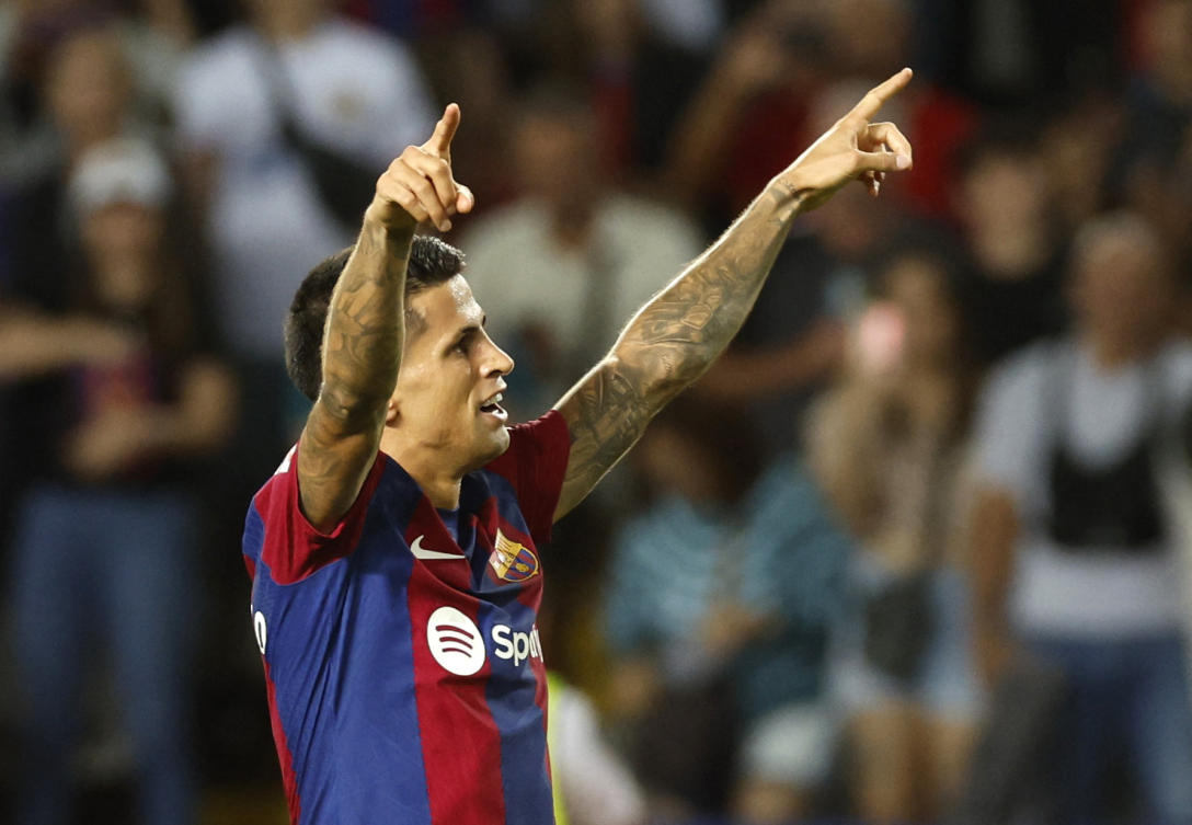 FC Barcelona’s Joao Cancelo celebrates scoring their third goal during their La Liga match against Celta Vigo at Estadi Olimpic Lluis Companys, Barcelona on Sept. 23, 2023. (Reuters)