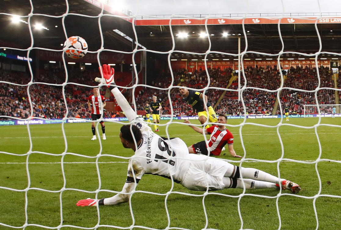 Newcastle United's Bruno Guimaraes scores their seventh goal past Sheffield United's Wes Foderingham. (Reuters)