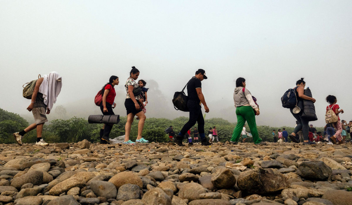 Migrants walk by the jungle near Bajo Chiquito village, the first border control of the Darien Province in Panama, on September 22, 2023. (AFP)